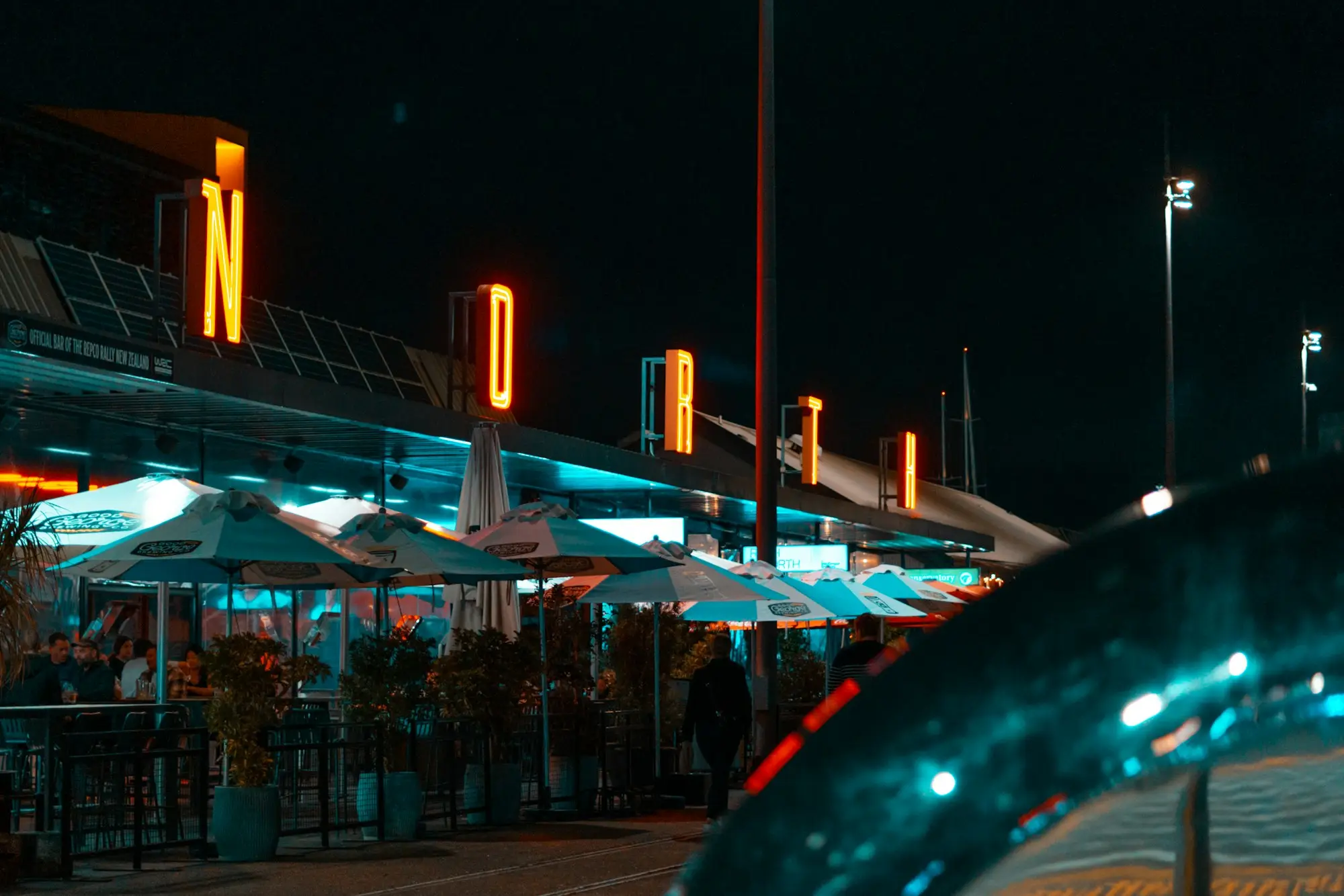 Market stalls lit up at night